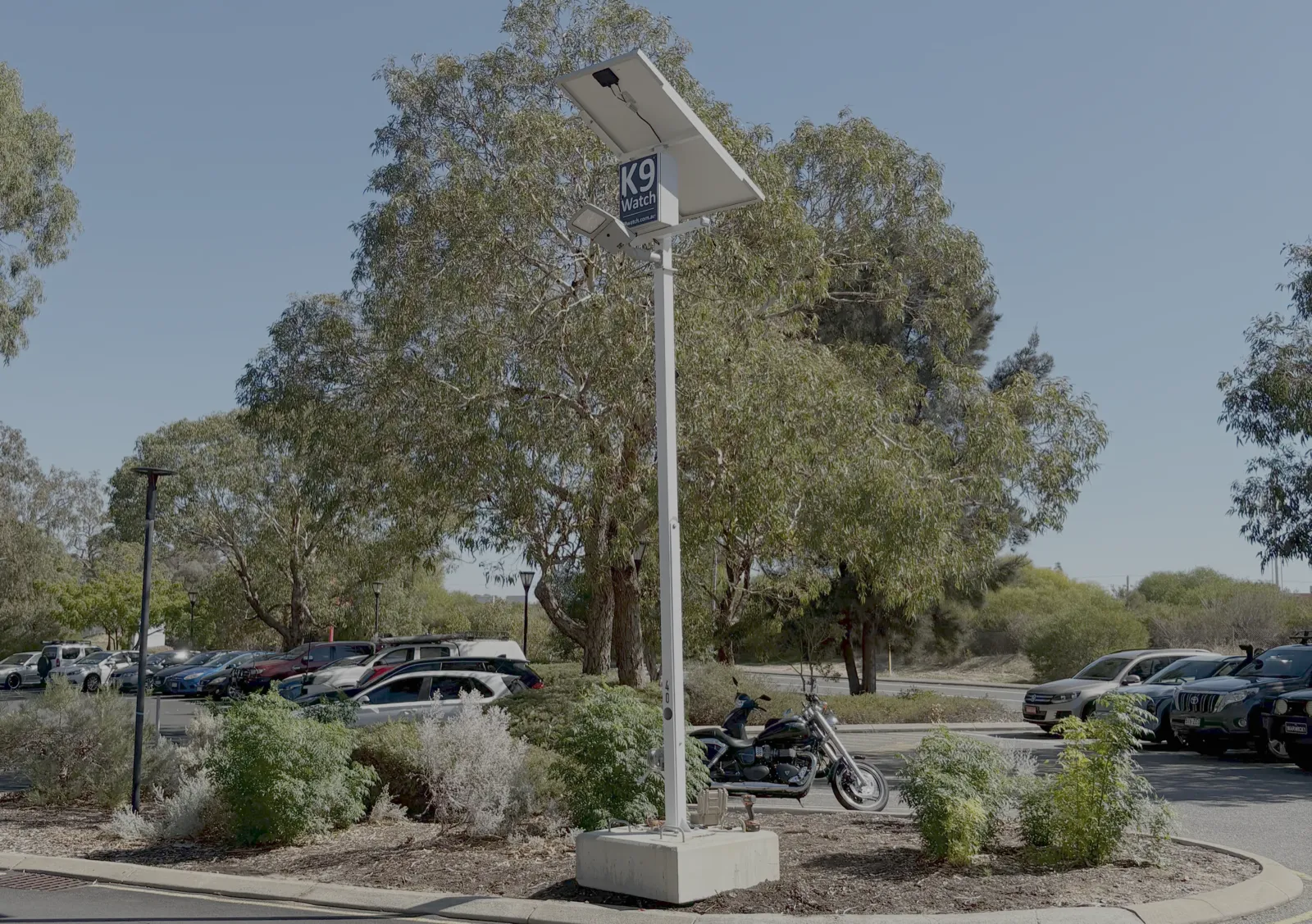 K9Watch camera and floodlight combination unit mounted on a pole in a Perth carpark